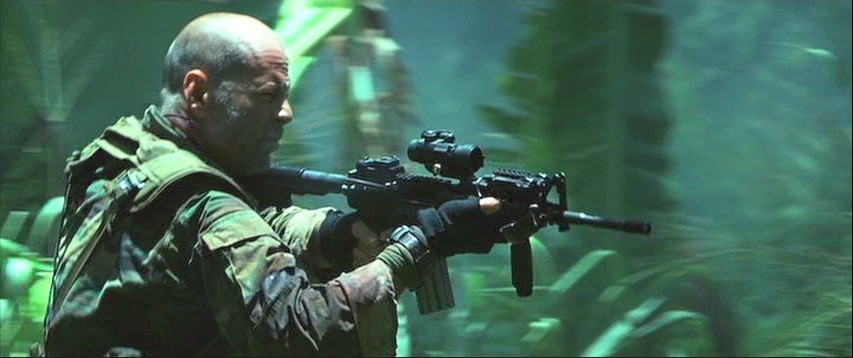 Lieutenant A.K. Waters (Bruce Willis) with his M4A1 with M68 Aimpoint scope and RIS foregrip.