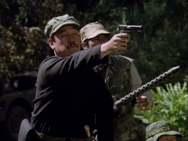 In "The Golden Triangle" (S1E02), Truang draws his M1911 at MacGyver atop the hill. Notice silver hammer and large markings beneath ejection port, signifying that this is a Colt Mk IV.