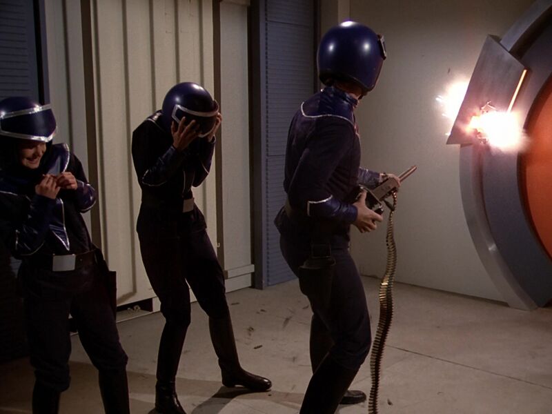 File:Buck Rogers in the 25th Century - S01E08 - Return of the Fighting 69th - Buck Fires M2 Aircraft at Door Mechanism.jpg