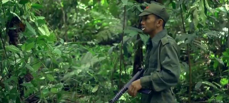 File:Malay Regiment IMFDB Communist on guard with Sterling SMG.jpg