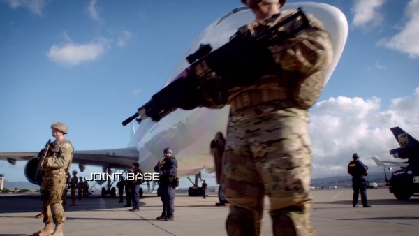 A Navy SEAL guards Wo Fat's plane at Joint Base Pearl Harbor-Hickam with a Mark 46 Mod 0 (S4E01).