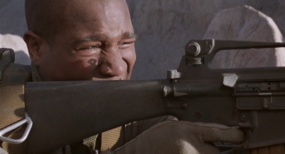 Sergeant Steven Altameyer (Seth Gilliam) aims an M16A2 rifle at attacking Iraqi soldiers